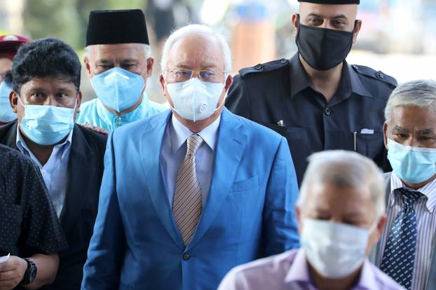 Former Malaysian Prime Minister Najib Razak and his supporters arrive at Kuala Lumpur High Court in Kuala Lumpur