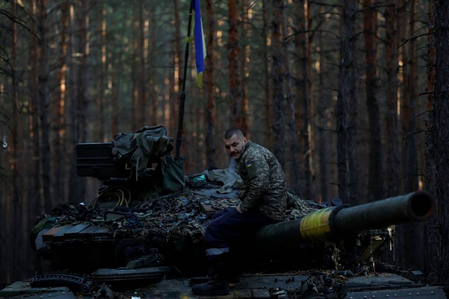 Ukrainian soldier makes repair to tanks, in Kupiansk region