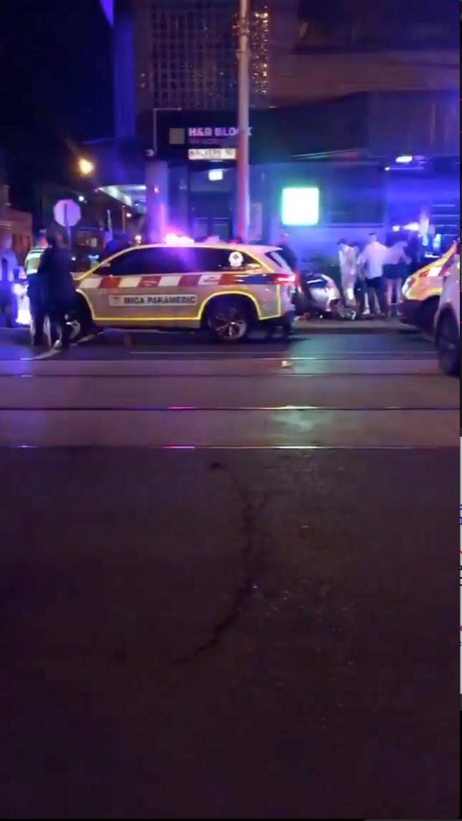 Police and rescue services are seen following a shooting incident outside a nightclub, in Prahran, Melbourne, Australia in this still frame taken from social media video