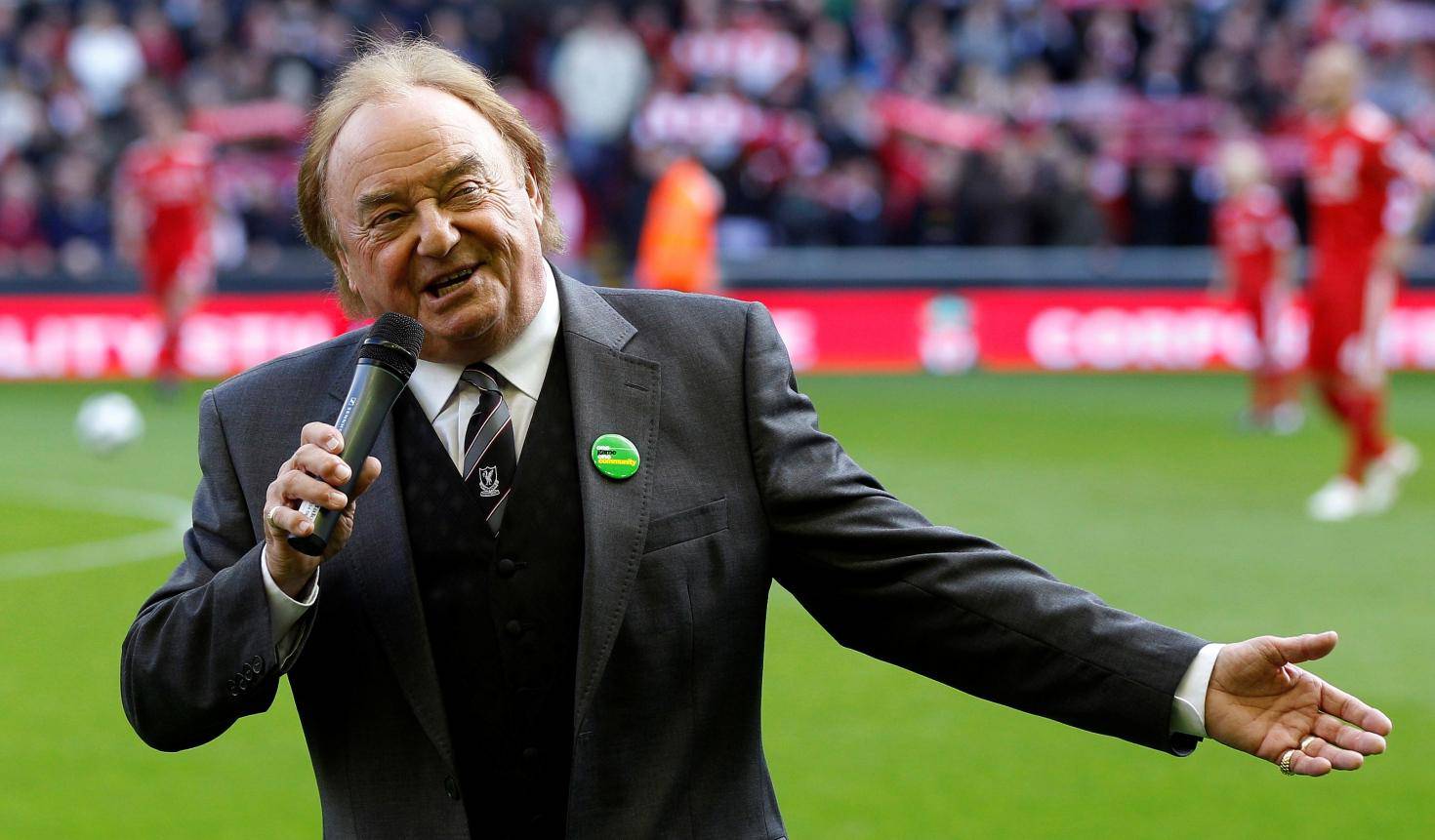 FILE PHOTO: Liverpool supporter and singer Marsden sings before their English Premier League soccer match against Blackburn Rovers at Anfield in Liverpool