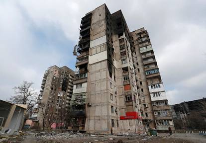 A view shows damaged residential buildings in the besieged city of Mariupol