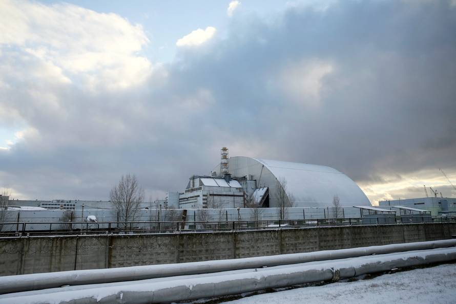A general view shows a New Safe Confinement structure over the old sarcophagus covering the damaged fourth reactor at the Chernobyl nuclear power plant, in Chernobyl