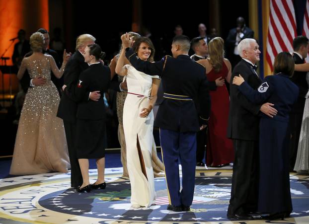 United States Army Staff Sergeant Jose A. Medina dances with U.S. first lady Melania Trump during the "Salute to Our Armed Services Ball" on Inauguration Day in Washington
