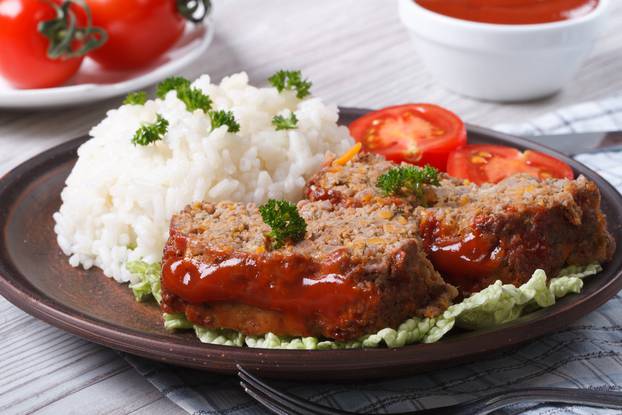 Sliced,Meat,Loaf,With,Rice,And,Vegetables,On,A,Plate