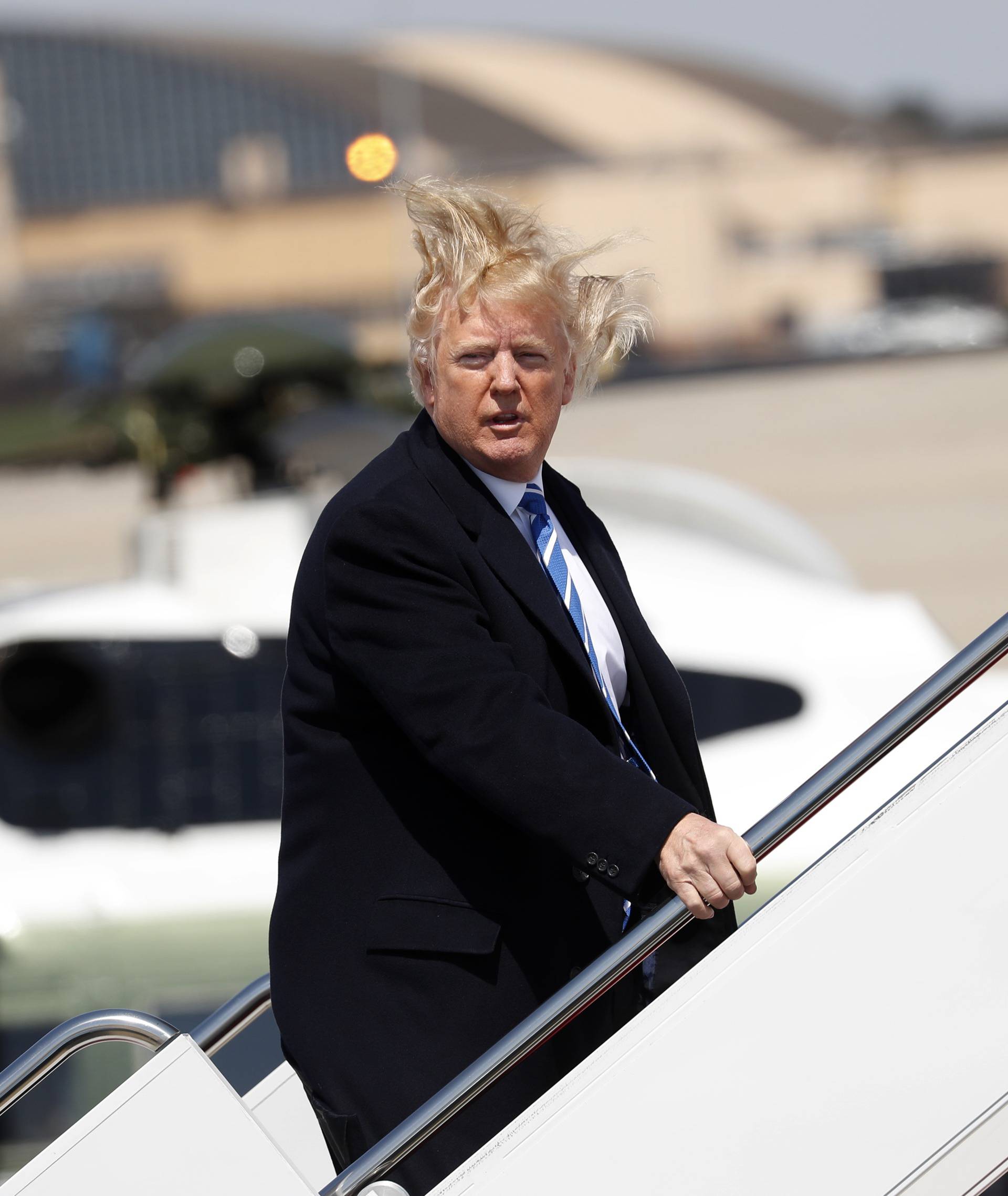 U.S. President Trump boards Air Force One before departing Joint Base Andrews, Maryland en route West Virginia