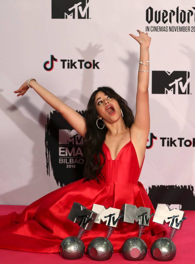 Camila Cabello poses with her awards during the 2018 MTV Europe Music Awards at Bilbao Exhibition Centre in Bilbao