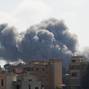 Smoke billows following an Israeli strike in  Kfar Joz