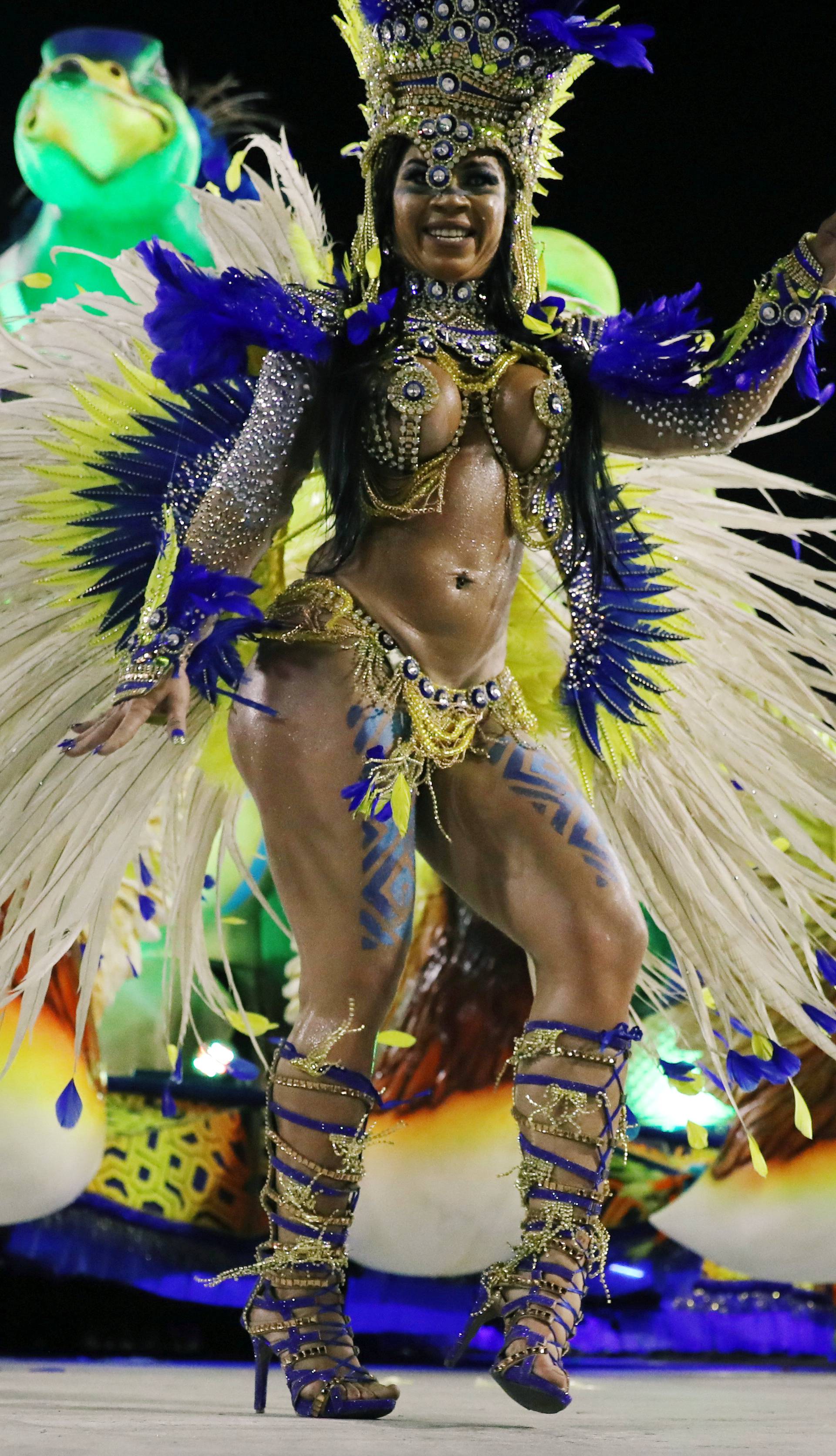 A reveller from Uniao da Ilha Samba school performs during the second night of the Carnival parade at the Sambadrome in Rio de Janeiro