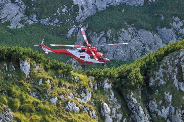 Mountain rescue team (TOPR) helicopter is pictured in Tatra mountains during a search mission near Zakopane