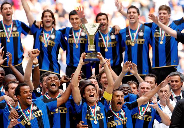 FILE PHOTO: Javier Zanetti lifts the Serie A trophy as Inter Milan players celebrate winning the title