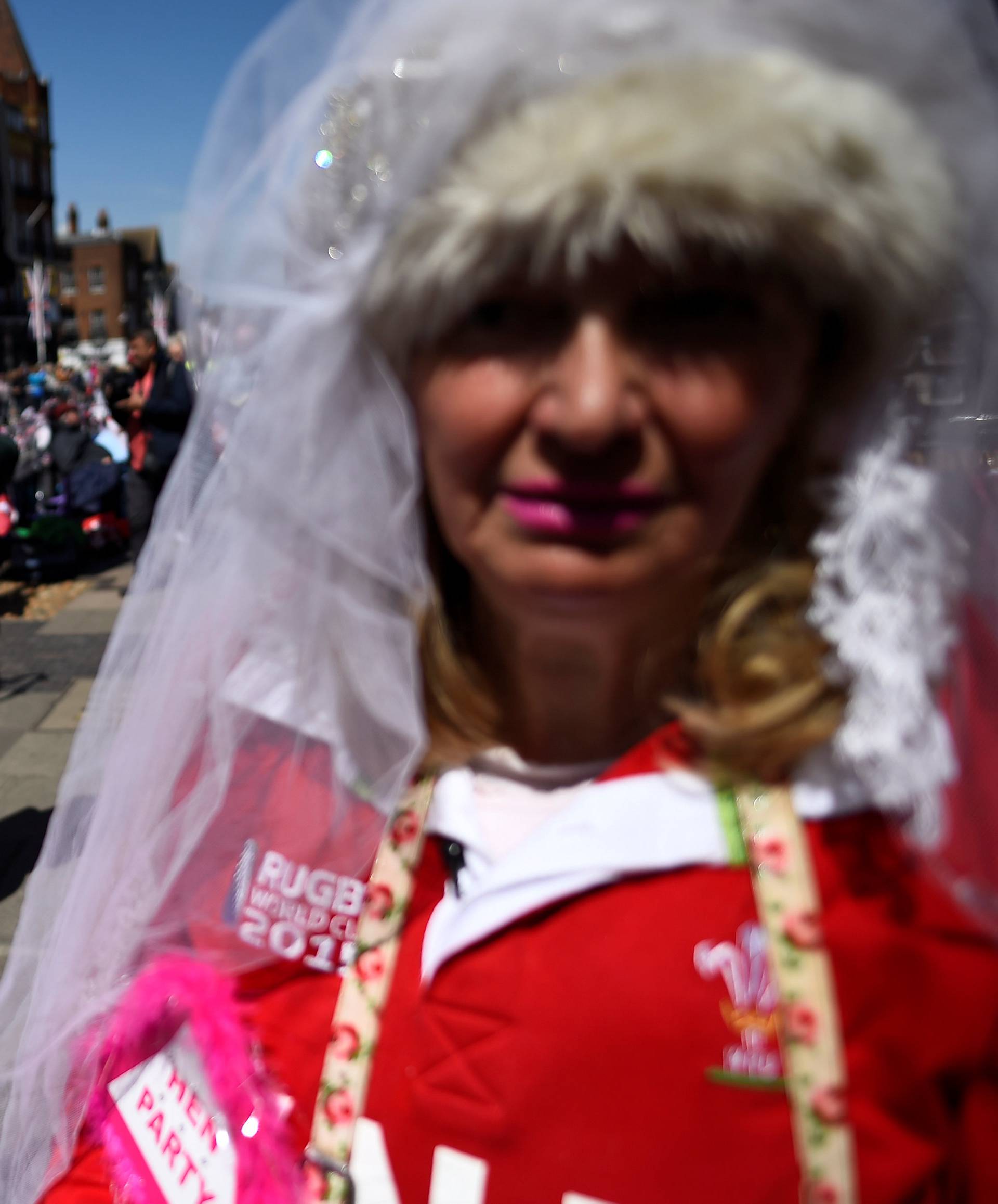 Fans of Britain's Royal Family wear themed outfits ahead of the wedding of Britain's Prince Harry and Meghan Markle in Windsor