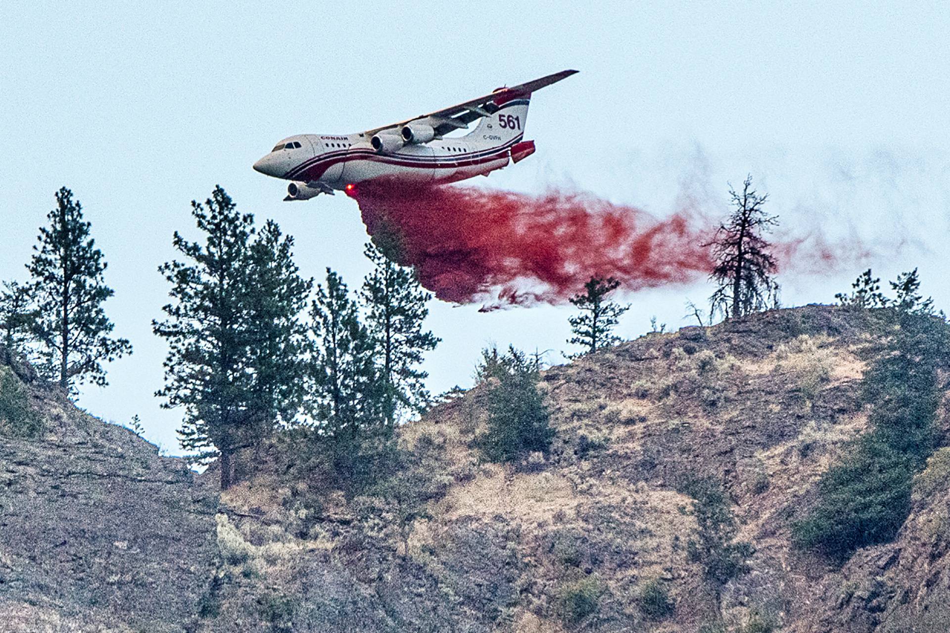 Conair airtanker drops fire retardant on part of the Nk'Mip Creek wildfire near Osoyoos