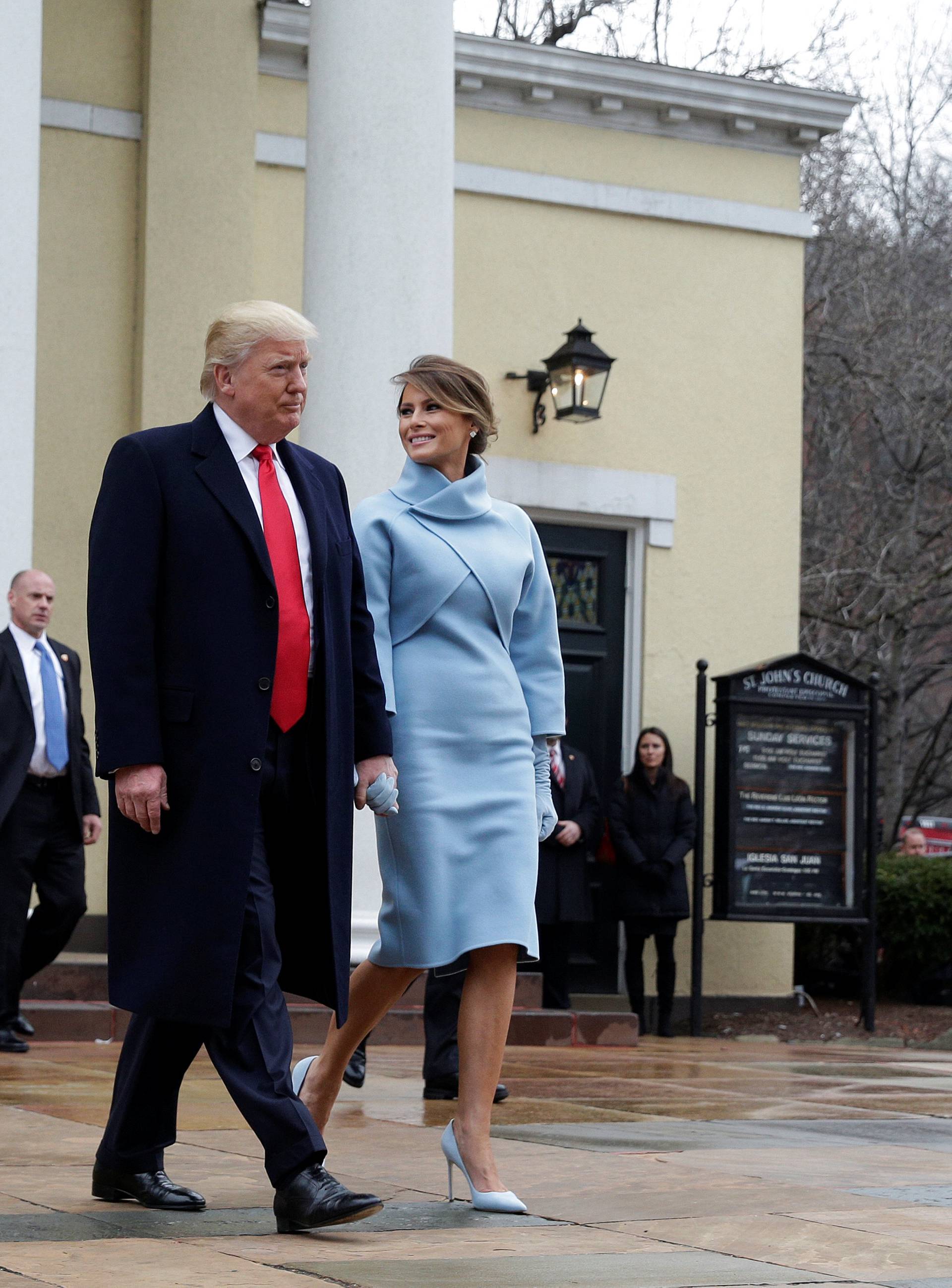 President-elect Donald Trump and his wife Melania depart from services at St. John's Church during his inauguration in Washington.