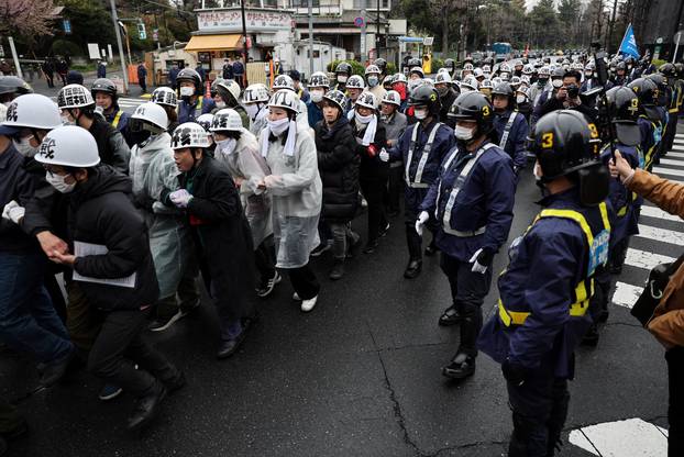 Protesters take part in an anti-U.S., anti-war and anti-Prime Minister Sanae Takaichi rally, in Tokyo