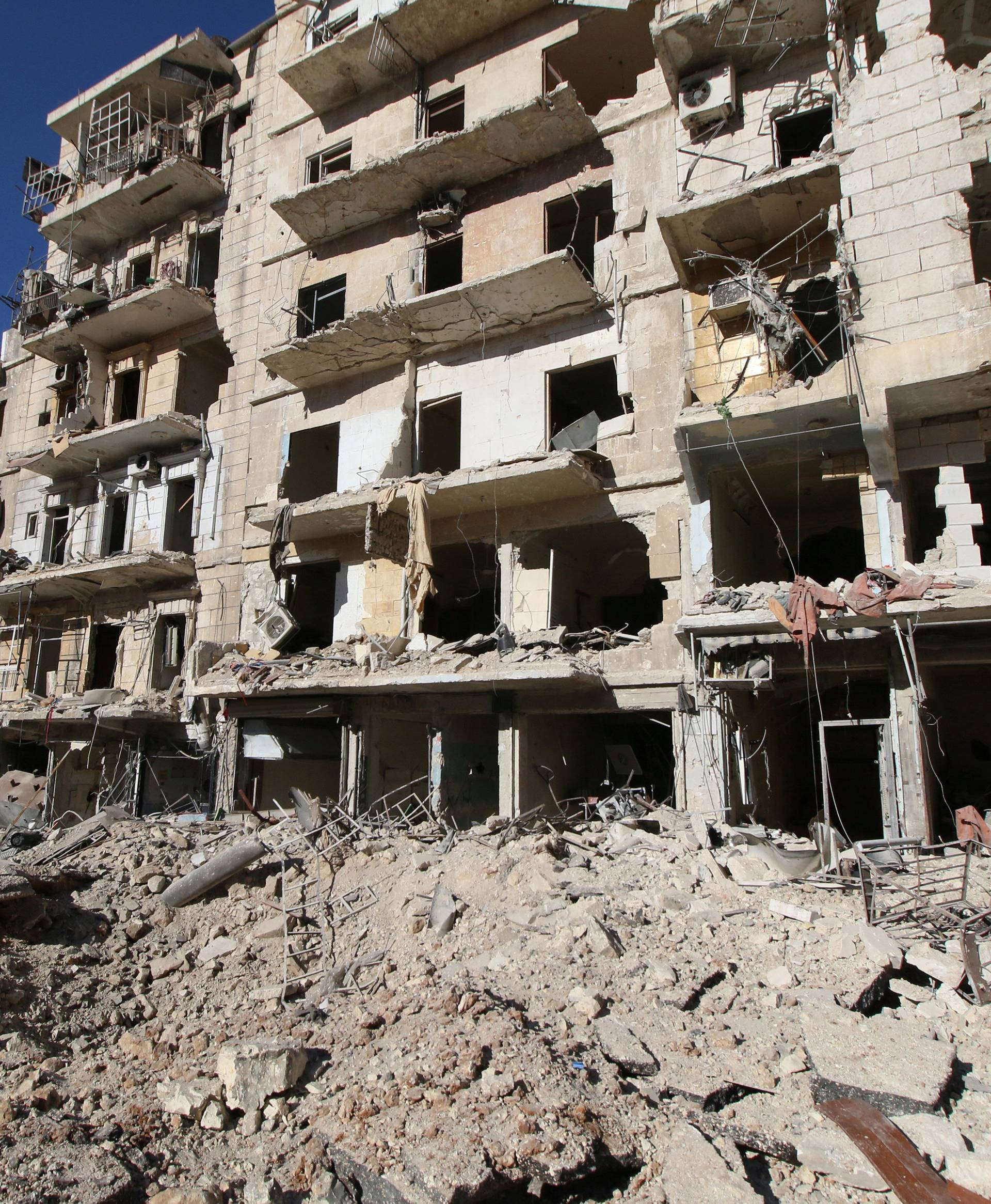 A general view shows the damage at a site hit by airstrikes in the rebel-held besieged al-Qaterji neighbourhood of Aleppo