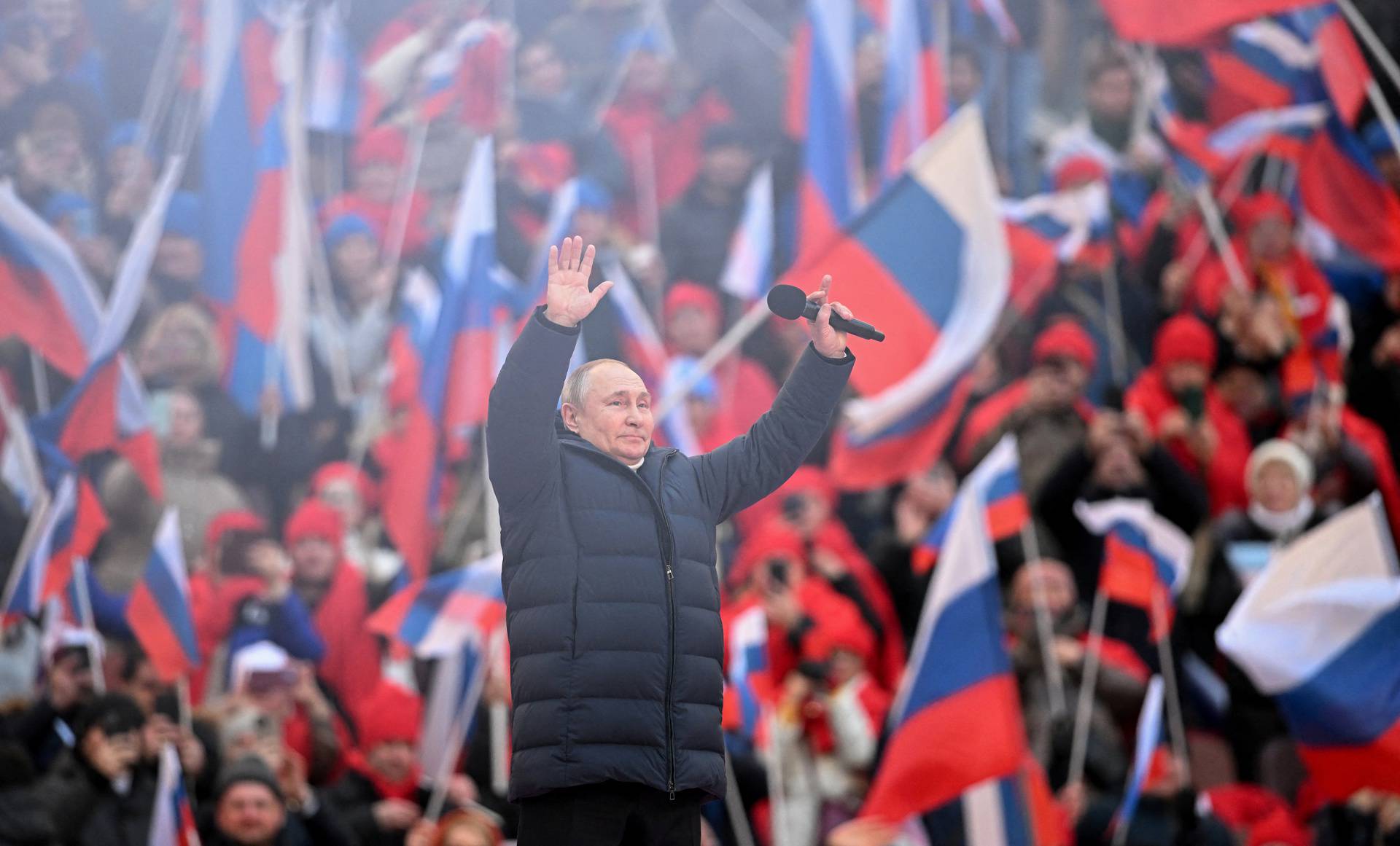 Russian President Vladimir Putin attends a concert marking the eighth anniversary of Russia's annexation of Crimea in Moscow