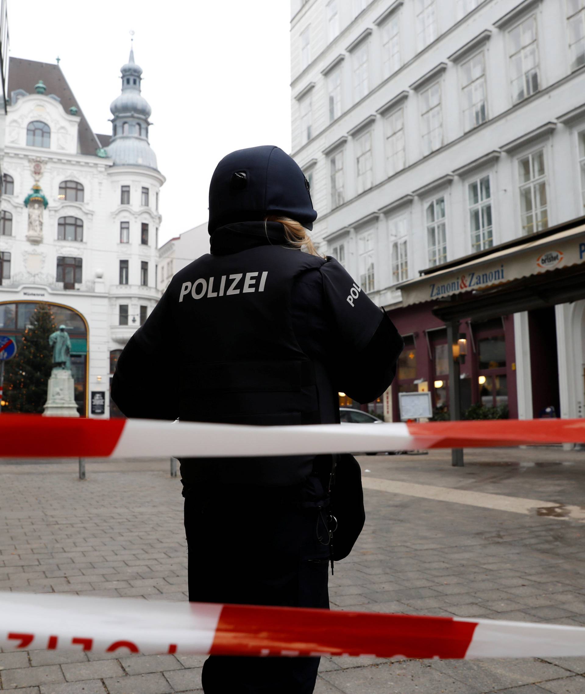 Police secure the area after shots were fired in a restaurant in Vienna