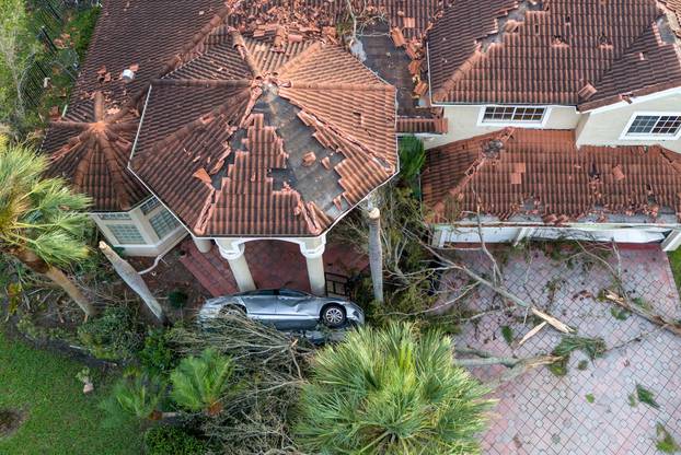 Damage to a home after a tornado ripped through The Preserve development as Hurricane Milton tracked across Florida