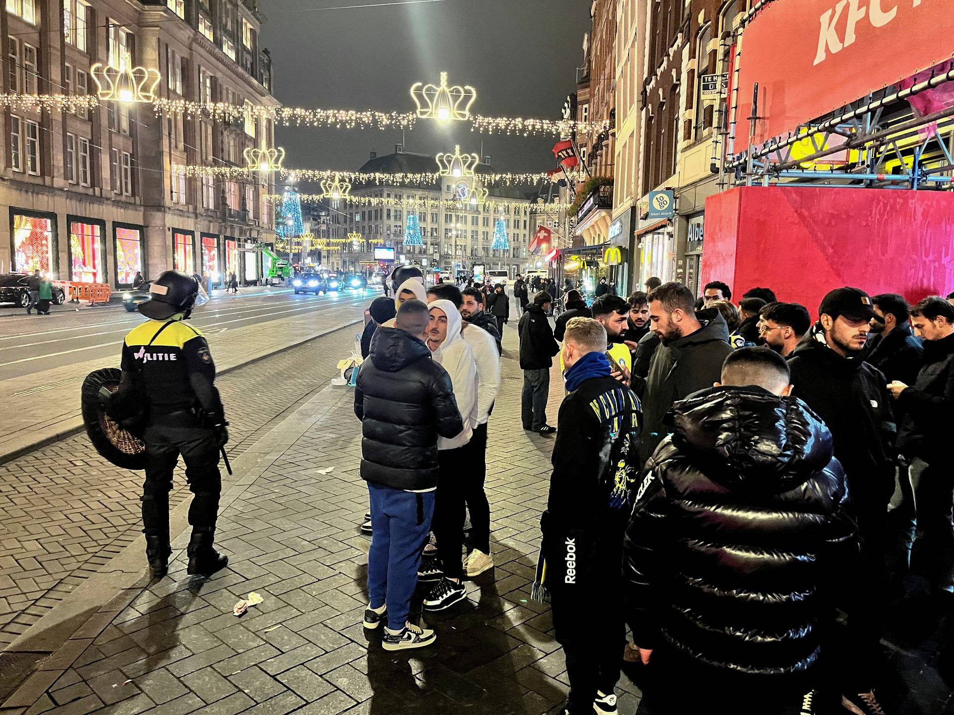 Israeli football supporters are guarded by police after violence targeting Israeli football fans broke out in Amsterdam overnight, in Amsterdam