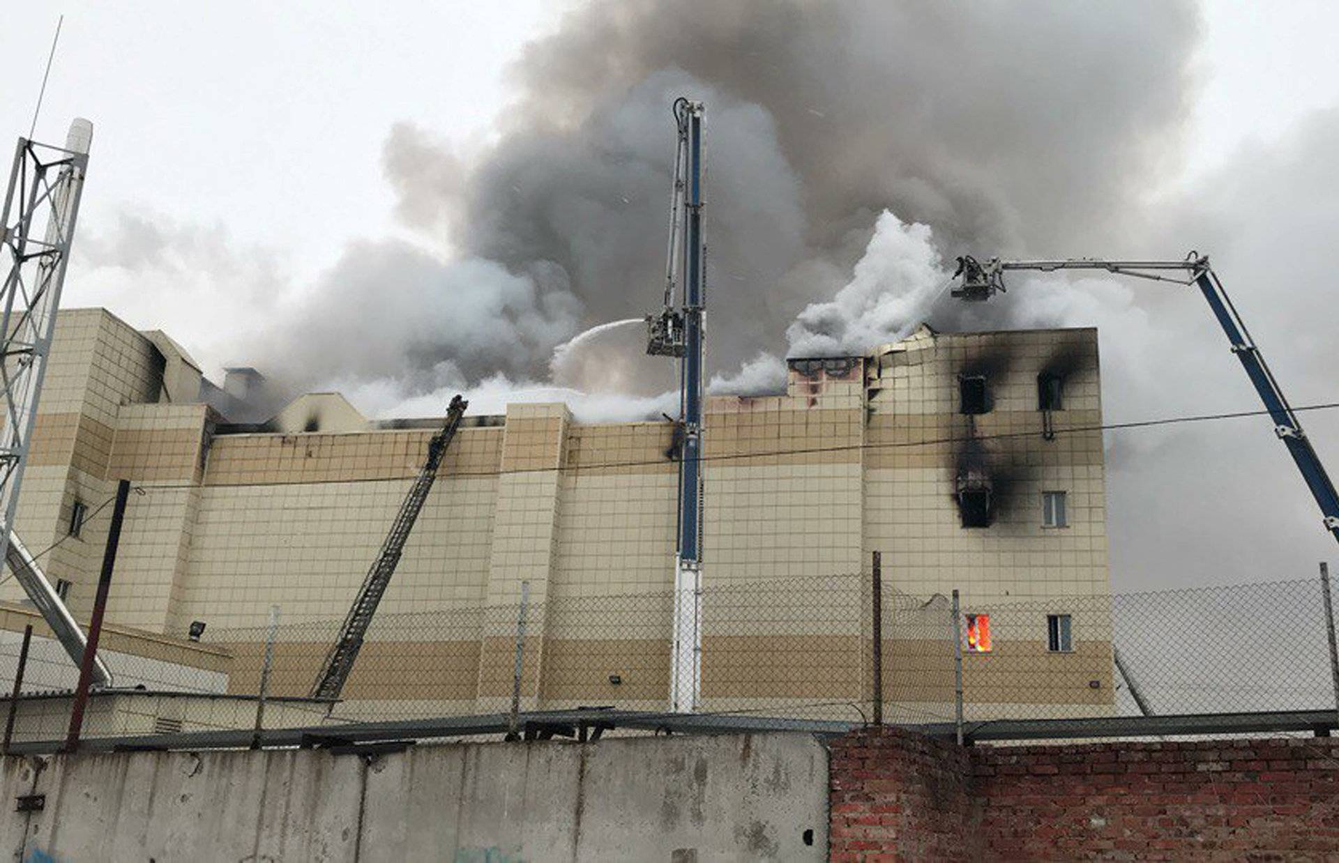 Firefighters extinguish a fire at a shopping mall in Kemerovo