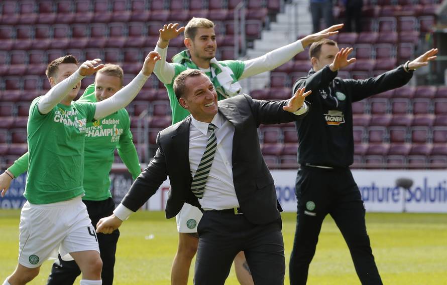 Celtic manager Brendan Rodgers and their players celebrate winning the Scottish Premiership