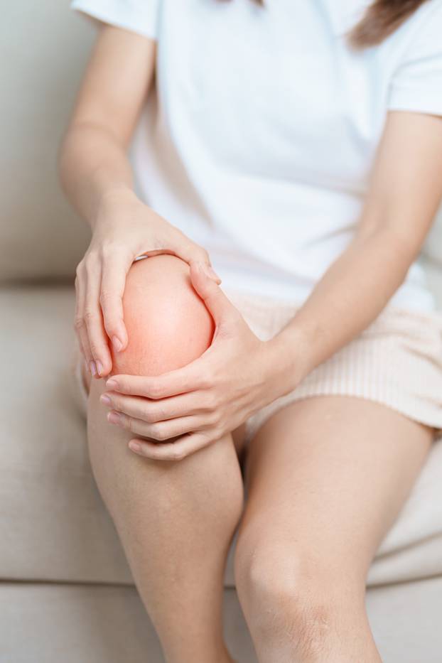 woman having knee ache and muscle pain due to Runners Knee or Pa