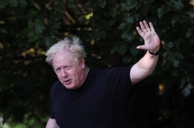 Former British Prime Minister Boris Johnson runs, in Brightwell-cum-Sotwell