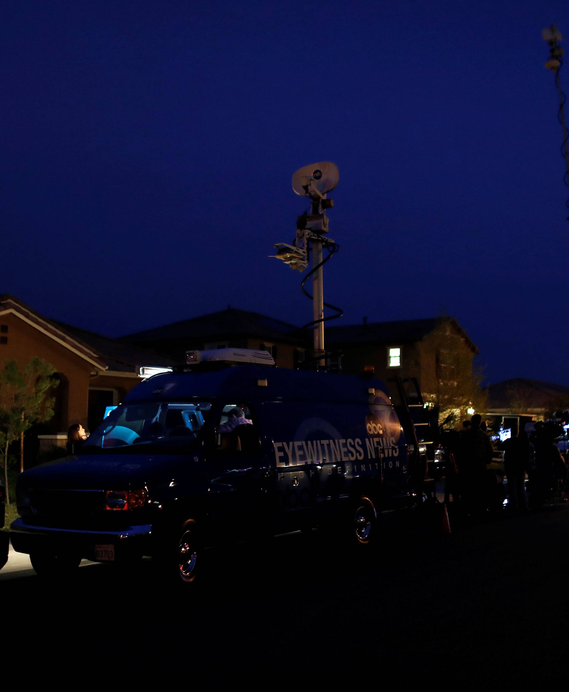 News crews gather outside the home of David Allen and Louise Anna Turpin in Perris, California