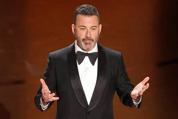 FILE PHOTO: Show host Jimmy Kimmel delivers his opening monologue at the 96th Academy Awards in Hollywood