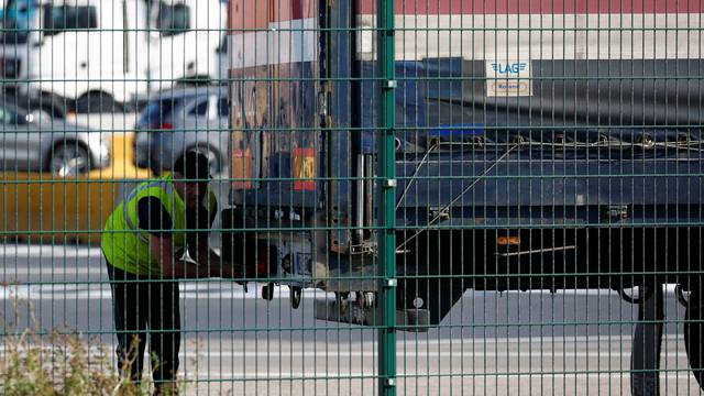 A truck driver is seen at the port of Zeebrugge after British police found bodies inside a lorry container in Grays, Essex, in Zeebrugge