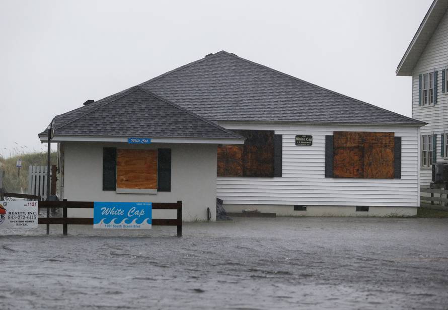 A house is surrounded by water during Hurricane Florence in North Myrtle Beach
