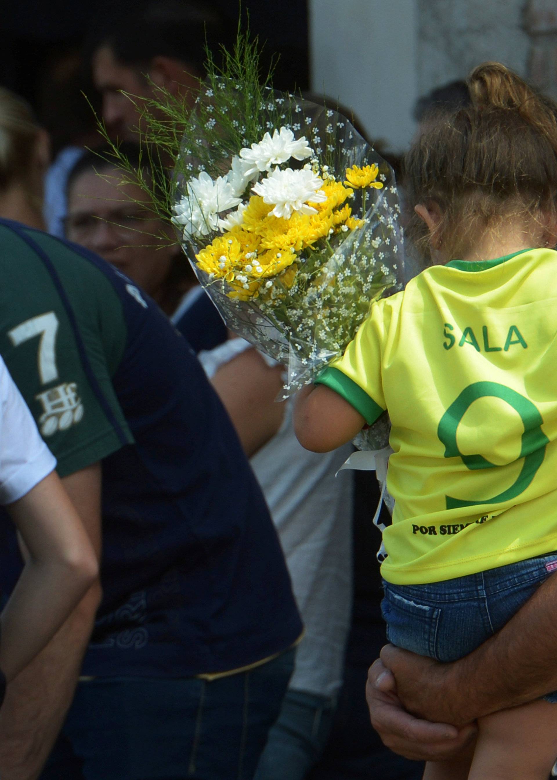 A girl wearing Emiliano Sala's jersey, former striker of French club Nantes, who died in a plane crash in the English Channel, attends his wake in Progreso