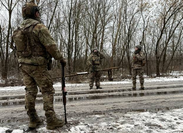 FILE PHOTO: Ukrainian servicemen observe the sky for Russian drones near the frontline town of Kostiantynivka