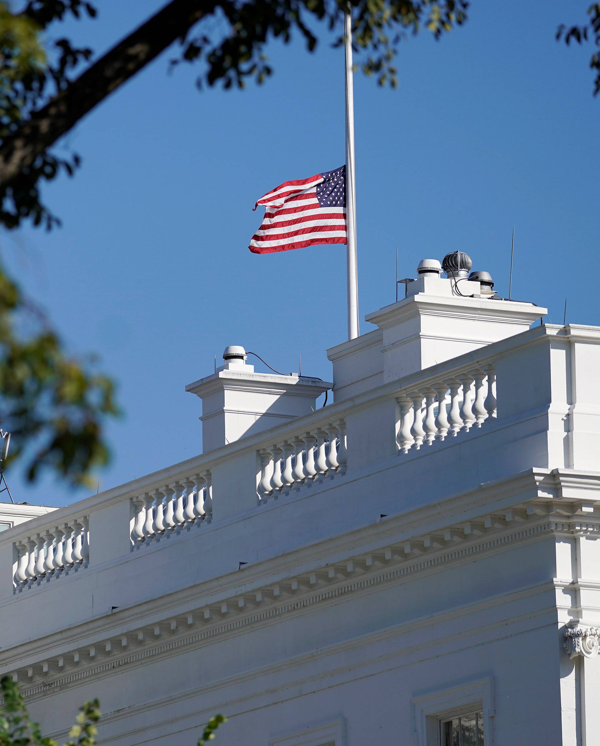 The U.S. flag flies at half-staff in the wake of a mass shooting in Las Vegas at the White House in Washington