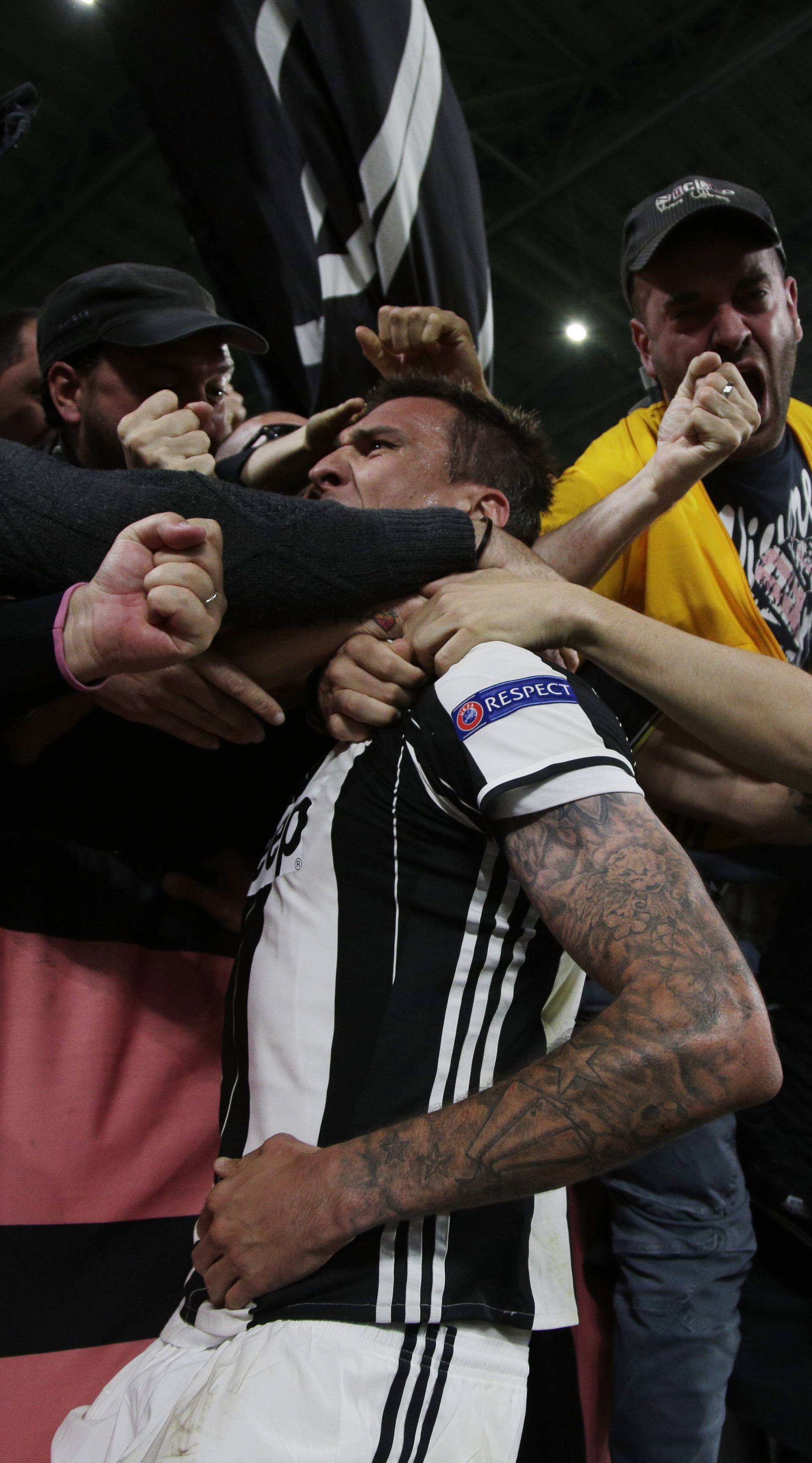 Juventus' Mario Mandzukic celebrates scoring their first goal with fans