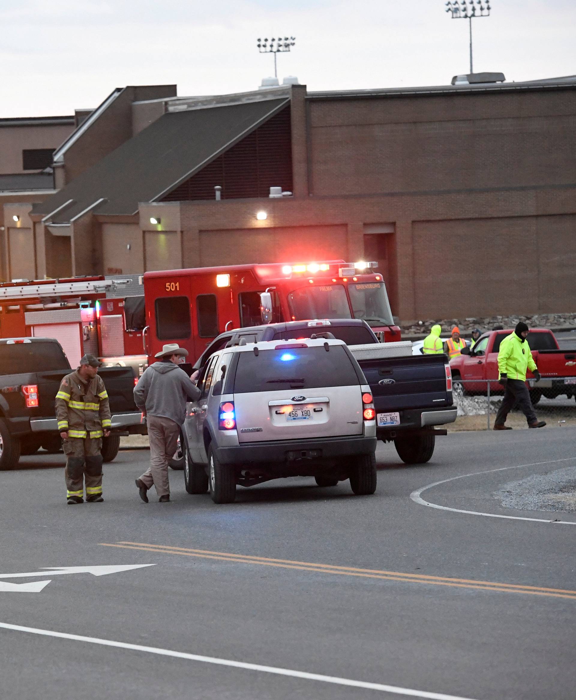 Police investigators are seen at the scene of a shooting at Marshall County High School in Benton, Kentucky