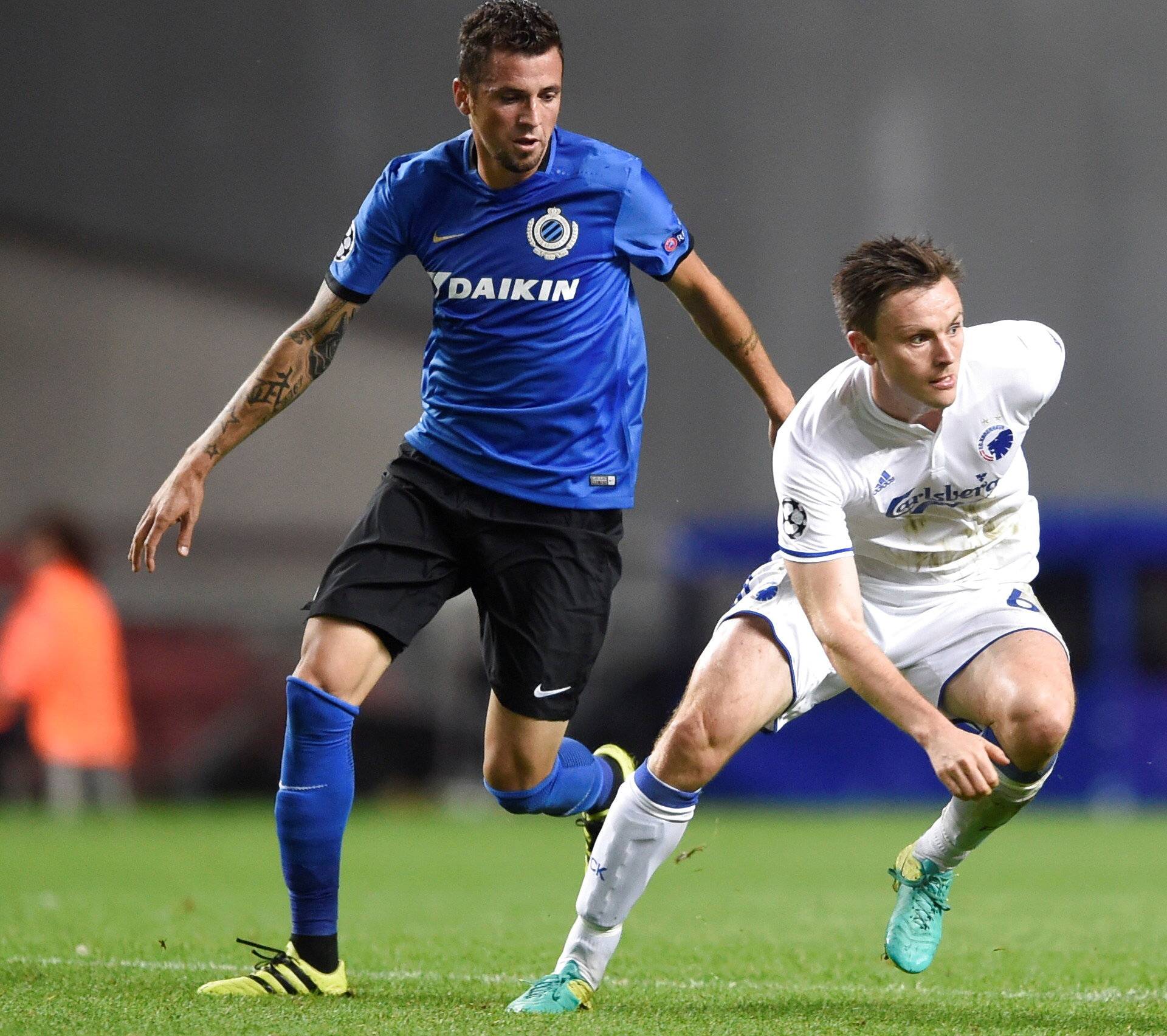 Club Brugge's Claudemir and FC Copenhagen's William Kvist trying to reach the ball during their UEFA Champions League Group G match