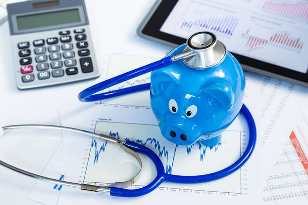 Stethoscope and piggy bank for health insurance concept