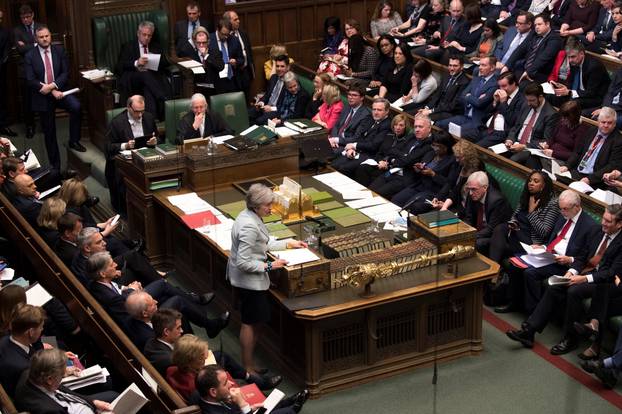 British Prime Minister Theresa May speaks in Parliament in London, Britain