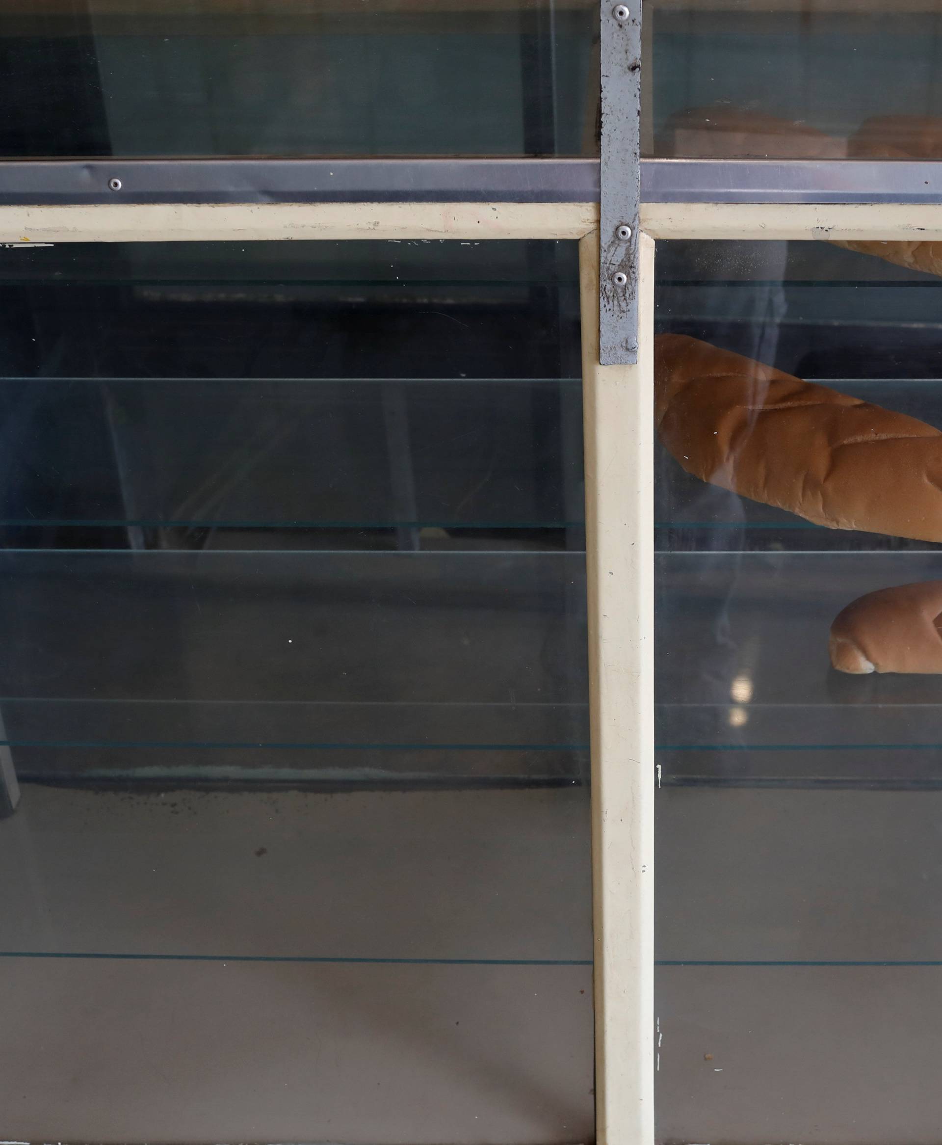 Bread for sale are seen in a shelf of the bakery of Annie Salazar at Rafael Urdaneta slum in Maracaibo
