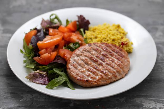 Grilled,Hamburger,With,Cereals,And,Salad,On,White,Plate,On