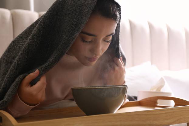 Woman,With,Plaid,Doing,Inhalation,Above,Bowl,Indoors