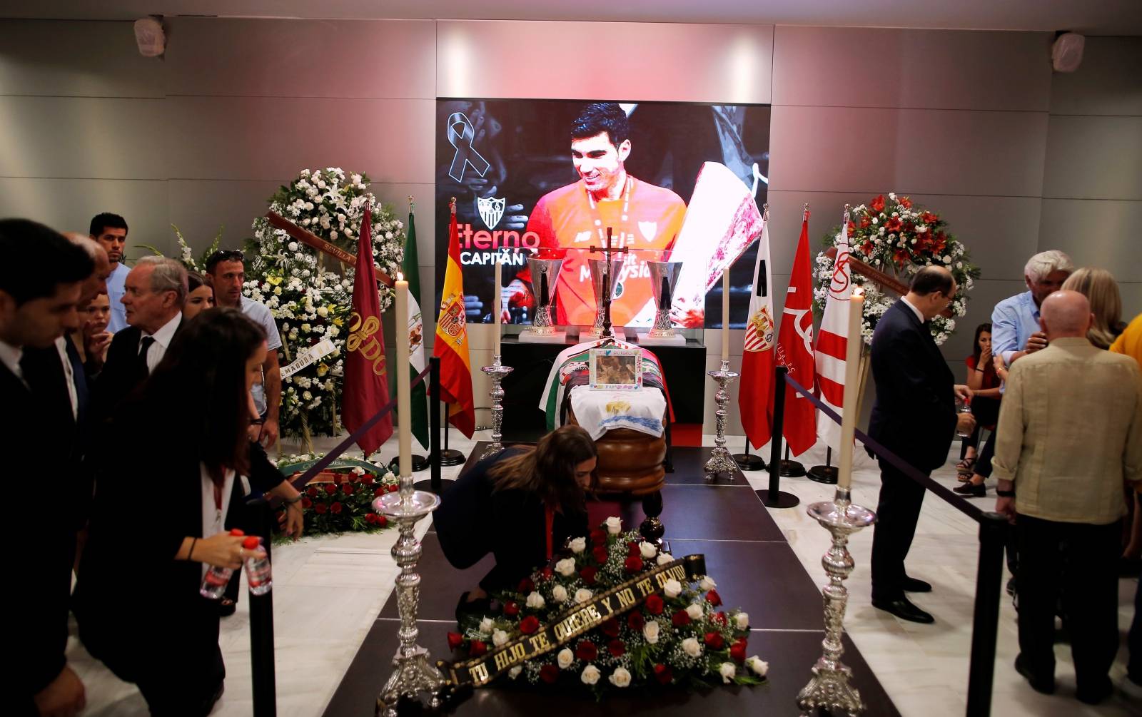 People attend the wake of Spanish footballer Reyes in Seville
