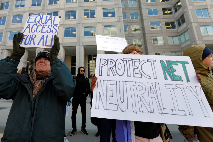 Net neutrality advocates rally in front of the Federal Communications Commission in Washington