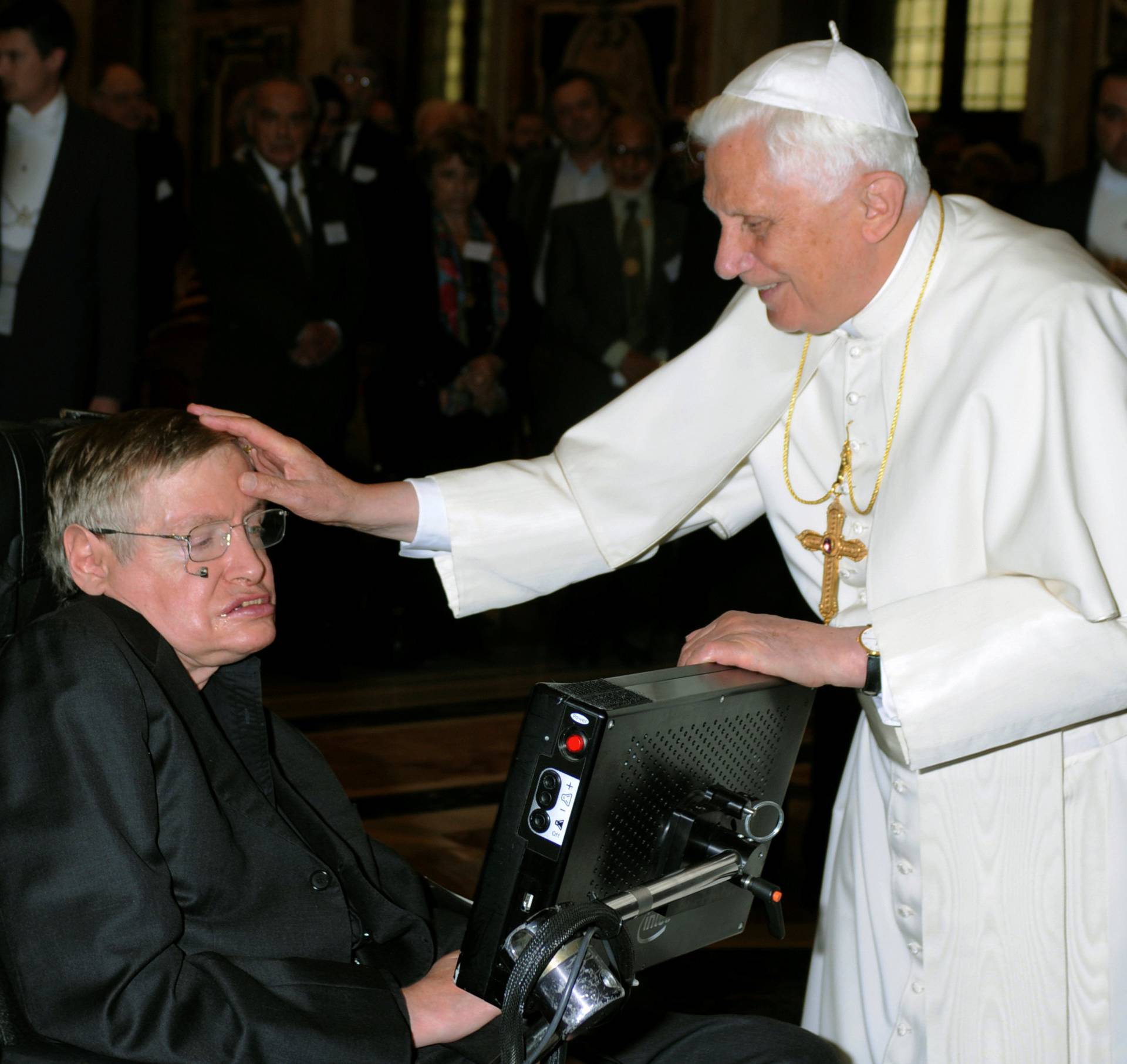 FILE PHOTO: Pope Benedict XVI greets British professor Hawking during a meeting of science academics at the Vatican