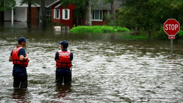 Coast Guard members inspect the flood waters caused by Hurricane Florence in Lumberton.