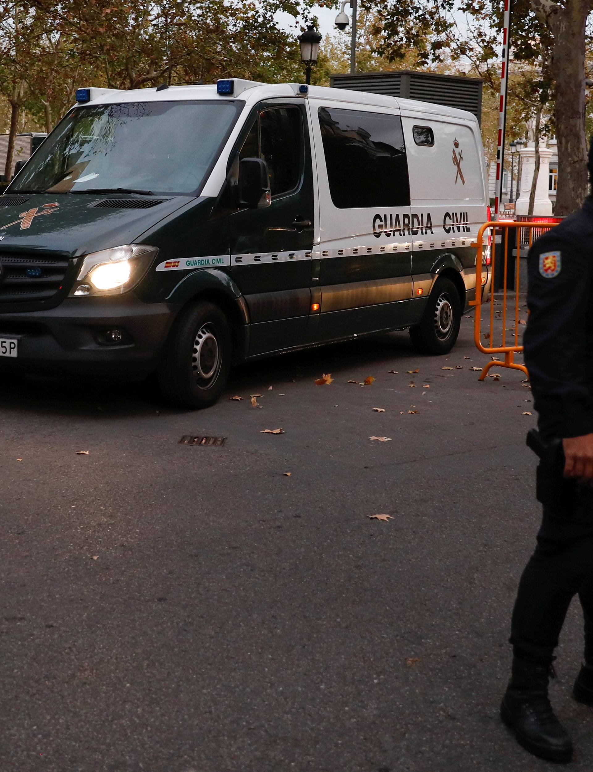 A van carrying members of the dismissed Catalan cabinet leaves a garage of Spain's High Court after they were remanded in custody in Madrid
