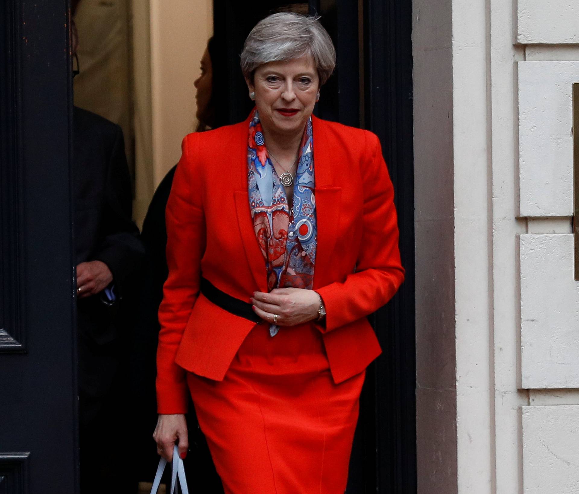 Britain's Prime Minister Theresa May leaves the Conservative Party's Headquarters after Britain's election in London