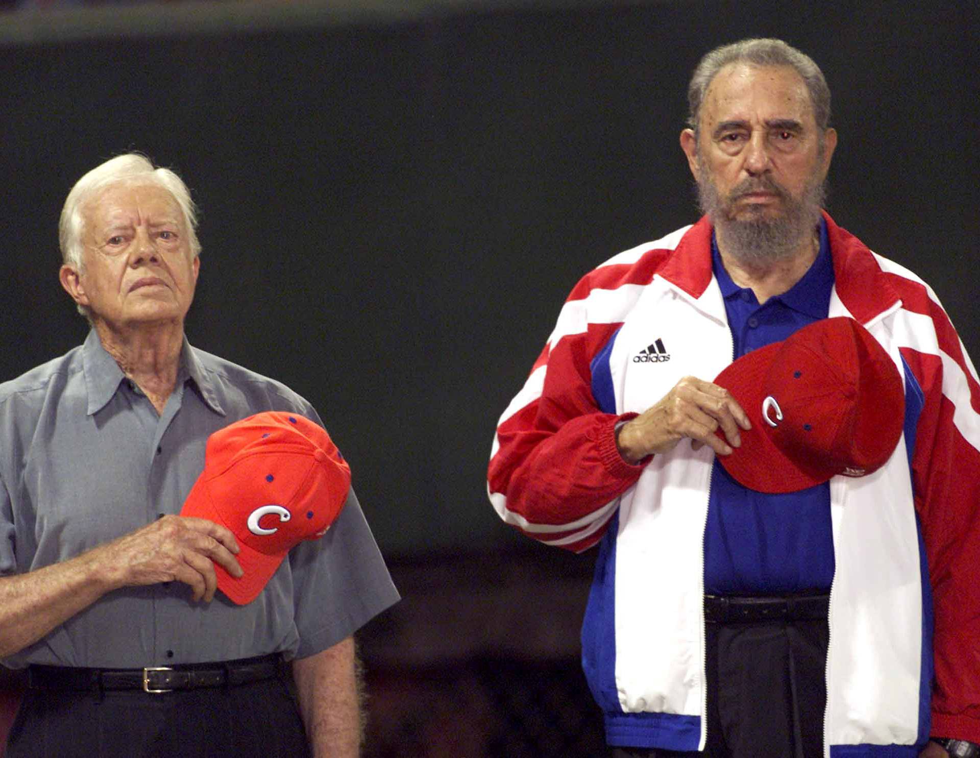 File photo of former U.S. President Jimmy Carter and then Cuban President Fidel Castro listening to the Cuban national anthem at the baseball stadium "Latinoamericano" in Havana