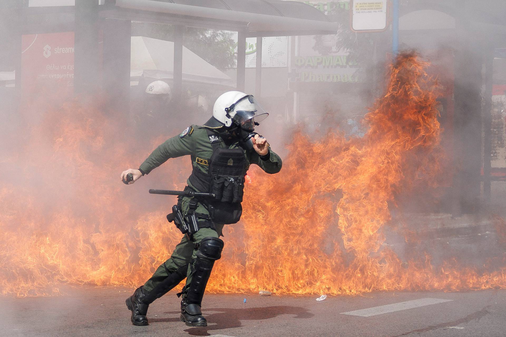 Protesters clash with police during a demonstration after a train crash near the city of Larissa, in Athens